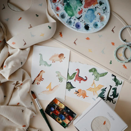 Mushie Placemat Dino koop je bij Babywinkel