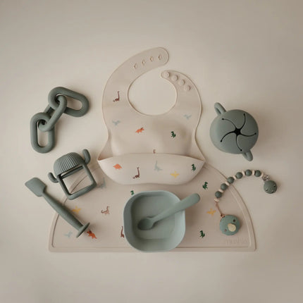 Mushie Slabbetje Silicone Dino koop je bij Babywinkel